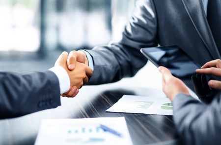 49572474 - business people shaking hands